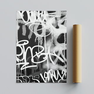 Black, white and grey graffiti spray paint abstract art print with graffiti-style text placed next to cardboard tube roll packaging.