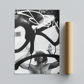 Black and white graffiti poster featuring a man holding a skateboard. Urban style photography paired with graffiti tags in a poster design. Placed next to a brown cardboard tube roll packaging.
