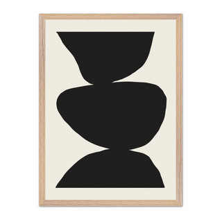 Minimalist black and white abstract poster with three bold black shapes stacked against a clean white background, showcased in a premium oak wooden frame.