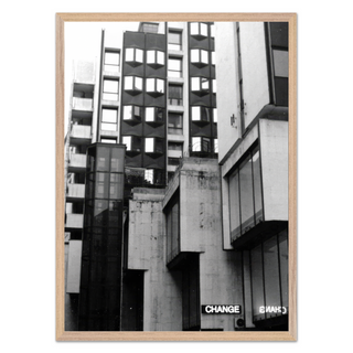 Black and white photographic art print featuring a Brutalist architecture cityscape with bold geometric shapes and industrial design elements. The photograph presents striking contrasts and shadows in an urban environment, offering a modern and contemporary visual style. Ideal for home decor, this print brings a sense of modernity and architectural elegance to living spaces. Perfect for those who appreciate unique urban photography and minimalist design aesthetics, reflecting the character of