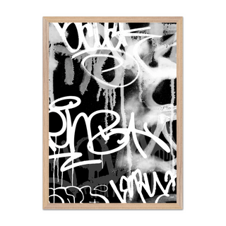 Black, white and grey graffiti spray paint abstract art print with graffiti-style text displayed in a oak wooden frame.