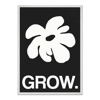 Framed artwork featuring a white abstract leaf design and the word 'GROW.' on a black background, displayed in a premium white wooden frame.
