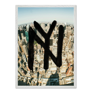 Framed urban artwork featuring New York graffiti over a cityscape, displayed in a premium white wooden frame.