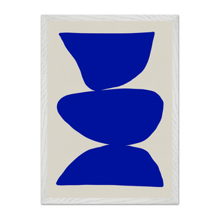 Cobalt blue abstract art with blue shapes on a beige background. Displayed in a white wooden frame.