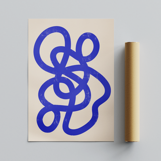 Top-down view of abstract art print with a bold blue design on a beige background, shown alongside a cardboard tube packaging roll.