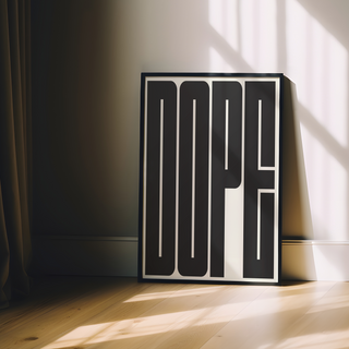 Bold black and white typography poster with the word 'DOPE' in bold, black letters on a white background. Displayed in a black premium wood frame.