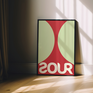 Bold red and green typography poster featuring the word 'SOUR', displayed in a premium black wooden frame.