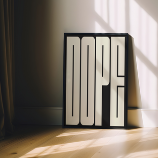 Bold typography poster of cream wording 'DOPE' on black background displayed inn a premium wooden black frame.