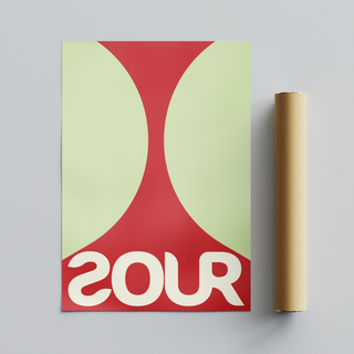 Bold red and green typography poster featuring the word 'SOUR', displayed next to roll tube cardboard packaging.