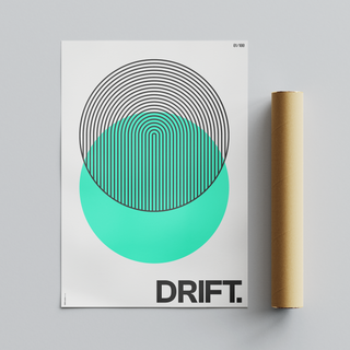 Bold Green circle abstract illustration with black typography poster with the word "drift" written at the bottom. Displayed next to brown cardboard tube packaging. 