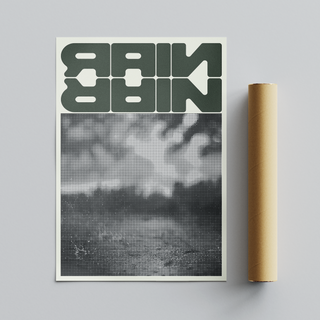 Framed modern urban artwork featuring green text saying 'rain' over a black and white pixelated abstract design, displayed next to cardboard tube roll packaging. 