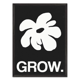 Framed artwork featuring a white abstract leaf design and the word 'GROW.' on a black background, displayed in a premium black wooden frame.