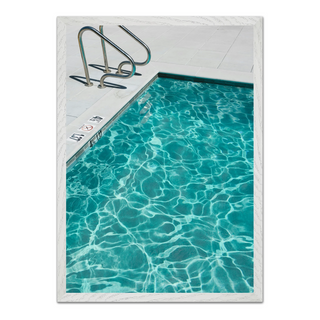 Framed photograph of a turquoise blue pool with clear water, displayed in a premium white wooden frame.