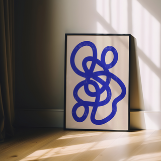 Abstract artwork featuring a bold blue design on a beige background, displayed in a premium black wooden frame, perfect for modern and minimalist wall decor.