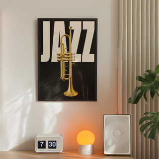 Black background Jazz music typography poster with gold trumpet and 'Jazz' text. Framed in a black wooden frame. Placed in minimal bedroom next to a plant and lamp. 