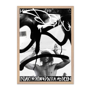 Black and white graffiti poster featuring a man holding a skateboard. Urban style photography paired with graffiti tags in a poster design. Displayed in a premium oak wooden frame. 