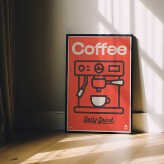 Red Poster with coffee machine illustration and 'Coffee Daily Grind' text on a red background displayed in black wooden frame. 