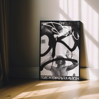 Black and white graffiti poster featuring a man holding a skateboard. Urban style photography paired with graffiti tags in a poster design. Displayed in a premium black wooden frame. 